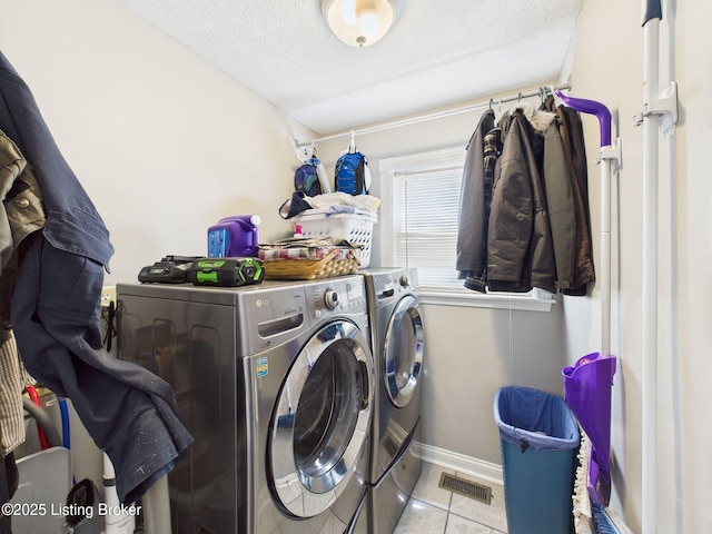 6408 Autumn Oak Way, Louisville, KY 40272 - laundry area featuring washer and clothes dryer, tile patterned floors, and a textured ceiling