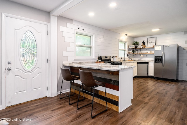 609 Lynn Rd, New Albany, IN 47150 - kitchen featuring stainless steel appliances, light stone countertops, dark wood-style flooring, open shelves, and recessed lighting