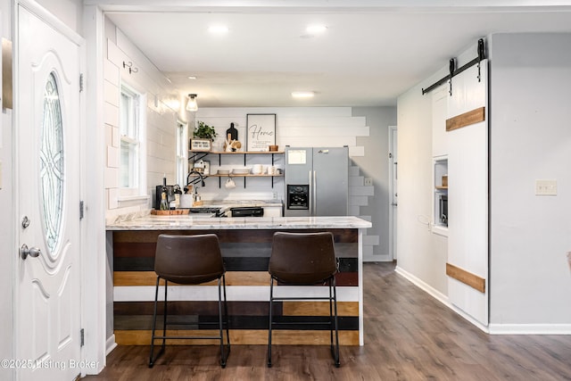 609 Lynn Rd, New Albany, IN 47150 - kitchen with stainless steel fridge with ice dispenser, dark wood-style flooring, a kitchen bar, a peninsula, and open shelves
