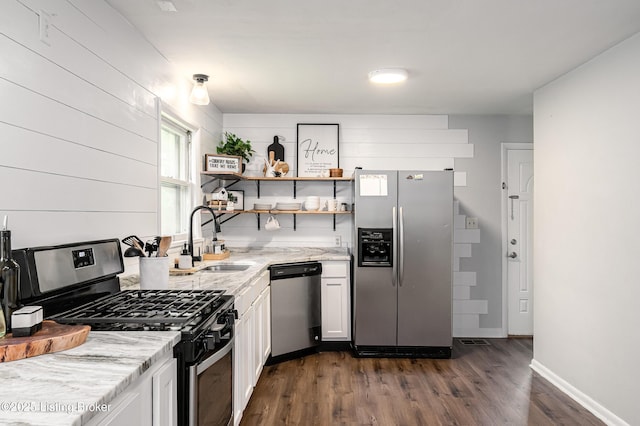 609 Lynn Rd, New Albany, IN 47150 - kitchen featuring appliances with stainless steel finishes, dark wood-type flooring, light stone counters, white cabinets, and open shelves