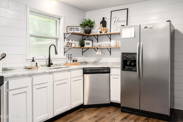 609 Lynn Rd, New Albany, IN 47150 - kitchen with appliances with stainless steel finishes, dark wood-style floors, white cabinetry, light stone countertops, and open shelves