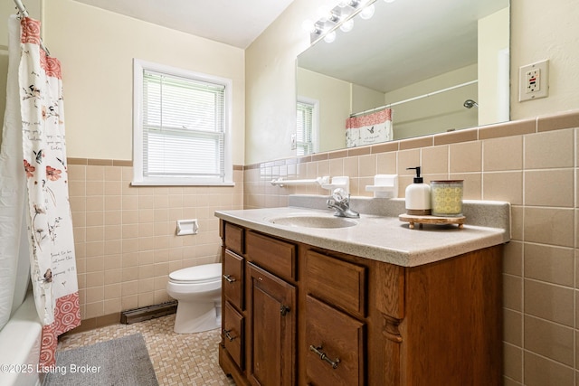 609 Lynn Rd, New Albany, IN 47150 - full bathroom with tile walls, vanity, tile patterned flooring, a wainscoted wall, and shower / bath combination with curtain