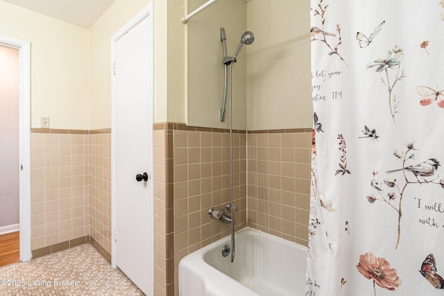 609 Lynn Rd, New Albany, IN 47150 - bathroom with tile walls, shower / bath combo with shower curtain, and wainscoting