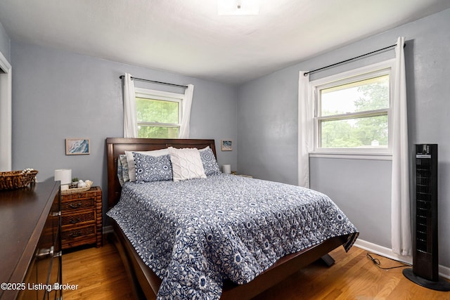 609 Lynn Rd, New Albany, IN 47150 - bedroom featuring wood finished floors and baseboards