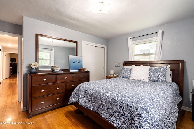 609 Lynn Rd, New Albany, IN 47150 - bedroom featuring light wood-style flooring and a closet