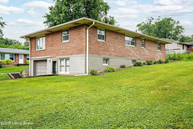609 Lynn Rd, New Albany, IN 47150 - rear view of house with a garage, brick siding, and a yard