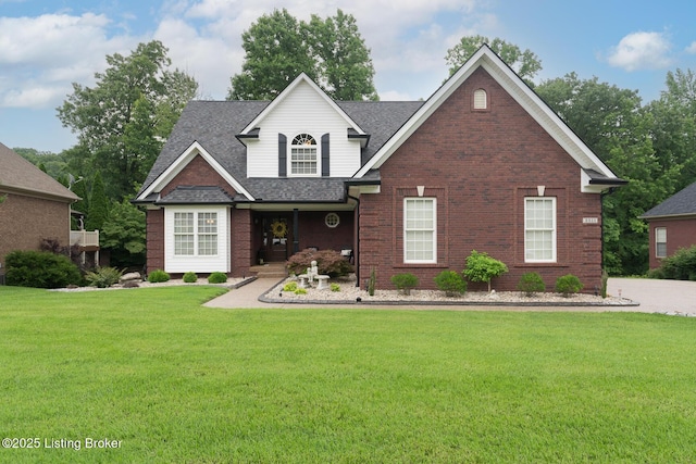3511 Hardwood Forest Dr, Louisville, KY 40214 - view of front of property featuring a front lawn, roof with shingles, brick siding, and covered porch