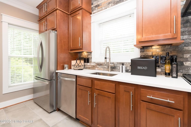 3511 Hardwood Forest Dr, Louisville, KY 40214 - kitchen with appliances with stainless steel finishes, backsplash, ornamental molding, light countertops, and plenty of natural light
