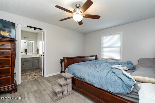570 Sulphur Rd, Smiths Grove, KY 42171 - bedroom with light wood finished floors, connected bathroom, and ceiling fan