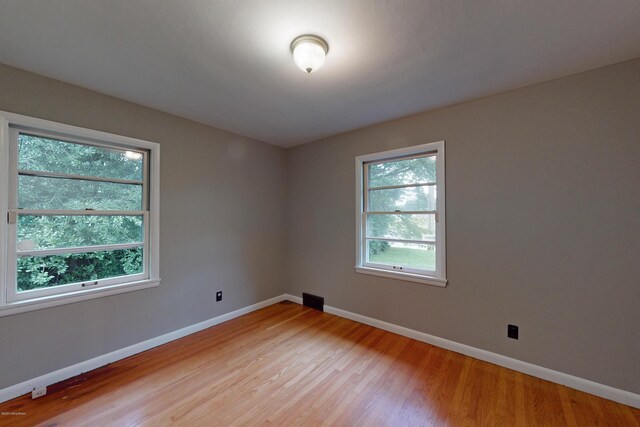 9212 Preston Hwy, Louisville, KY 40229 - empty room with light wood-style flooring and baseboards