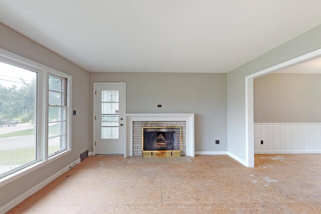 9212 Preston Hwy, Louisville, KY 40229 - unfurnished living room with a brick fireplace and baseboards