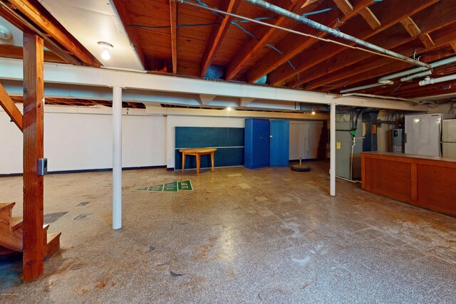 9212 Preston Hwy, Louisville, KY 40229 - basement with heating unit, water heater, and refrigerator