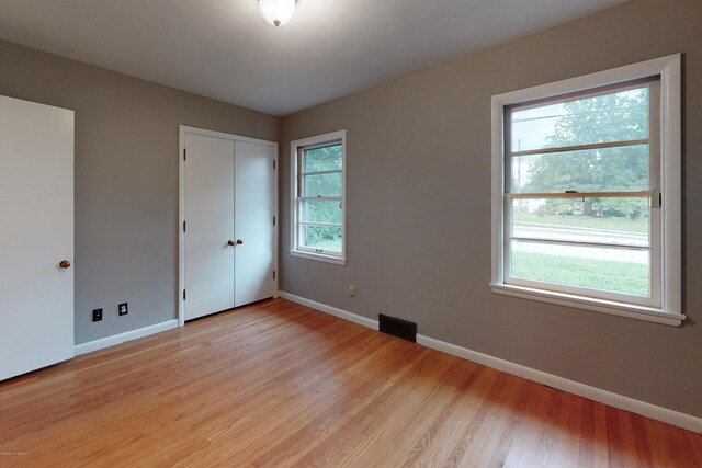 9212 Preston Hwy, Louisville, KY 40229 - unfurnished bedroom with baseboards and light wood-style floors