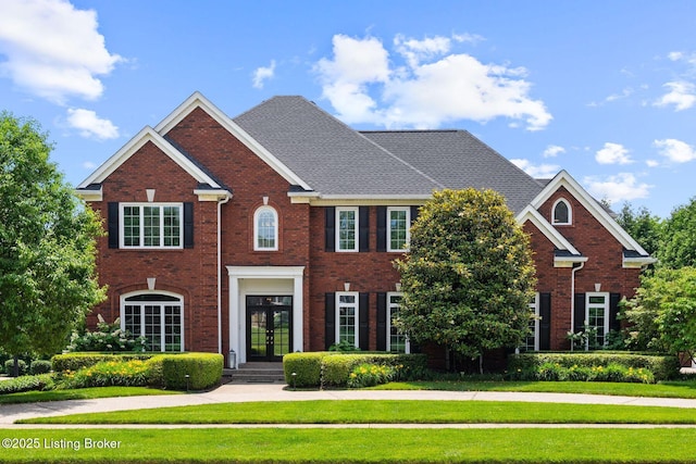 12812 Ridgemoor Dr, Prospect, KY 40059 - colonial home featuring french doors, a front lawn, and brick siding