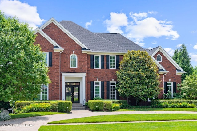 12812 Ridgemoor Dr, Prospect, KY 40059 - view of front of property featuring french doors, a front lawn, and brick siding