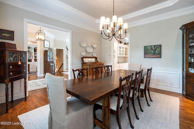 12812 Ridgemoor Dr, Prospect, KY 40059 - dining area with a chandelier, dark wood-type flooring, ornamental molding, stairway, and wainscoting