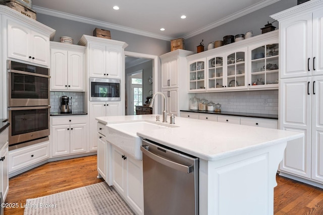 12812 Ridgemoor Dr, Prospect, KY 40059 - kitchen featuring stainless steel appliances, decorative backsplash, recessed lighting, white cabinetry, and light wood finished floors
