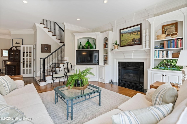 12812 Ridgemoor Dr, Prospect, KY 40059 - living room with stairway, wood finished floors, crown molding, a fireplace, and recessed lighting