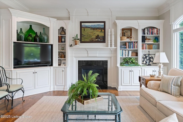 12812 Ridgemoor Dr, Prospect, KY 40059 - living room featuring wood finished floors, a premium fireplace, crown molding, and built in features