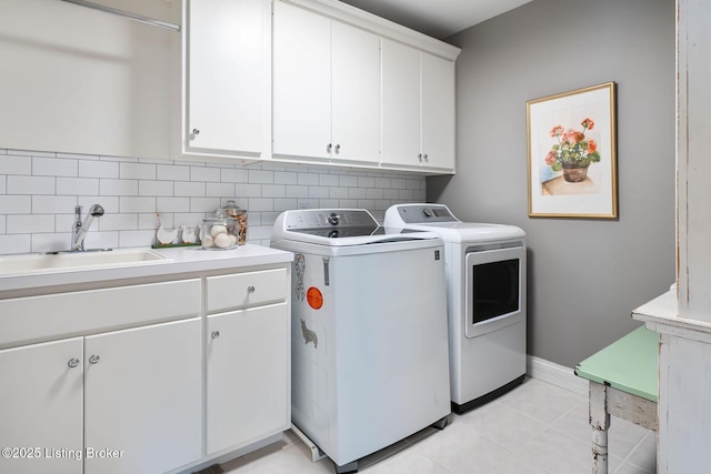 12812 Ridgemoor Dr, Prospect, KY 40059 - laundry room featuring cabinet space, washer and clothes dryer, and light tile patterned floors