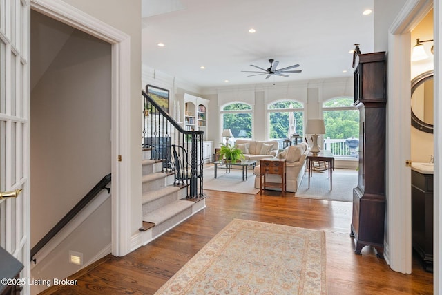 12812 Ridgemoor Dr, Prospect, KY 40059 - foyer featuring ceiling fan, stairs, dark wood-style flooring, recessed lighting, and crown molding