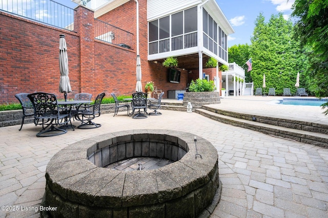 12812 Ridgemoor Dr, Prospect, KY 40059 - view of patio featuring an outdoor pool, a fire pit, and a sunroom