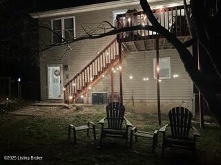 4021/2 Ripy St, Lawrenceburg, KY 40342 - back of house at night with stairs and a wooden deck