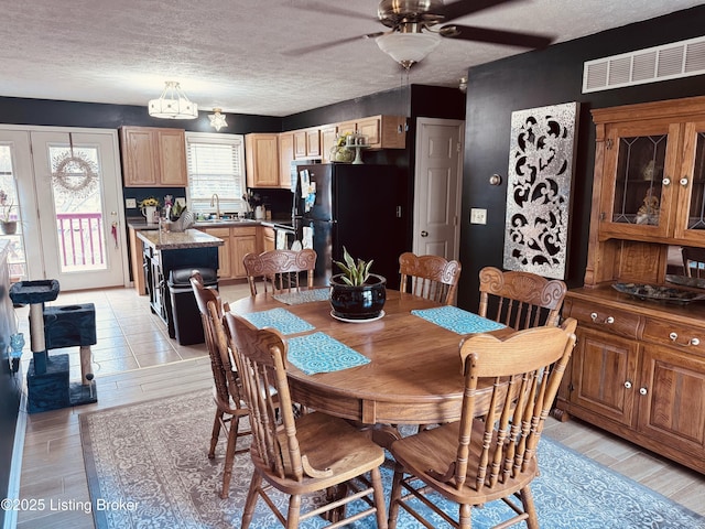 4021/2 Ripy St, Lawrenceburg, KY 40342 - dining space featuring ceiling fan, light wood-style flooring, and a textured ceiling