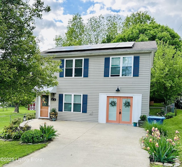 4021/2 Ripy St, Lawrenceburg, KY 40342 - view of front of property with roof mounted solar panels, french doors, and driveway