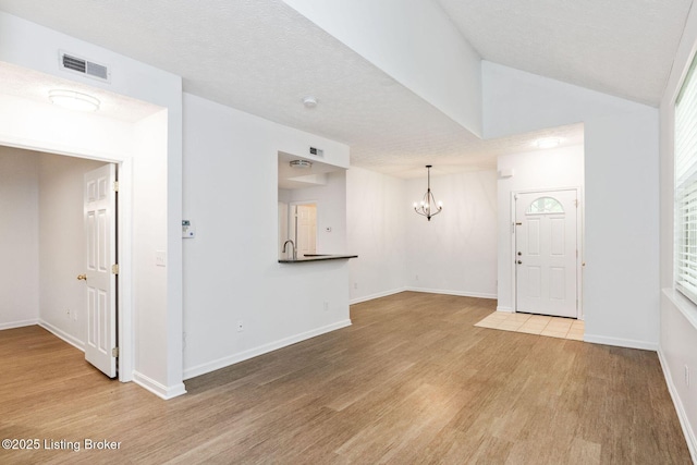 13404 Prospect Glen Way, Prospect, KY 40059 - spare room with wood finished floors and a chandelier