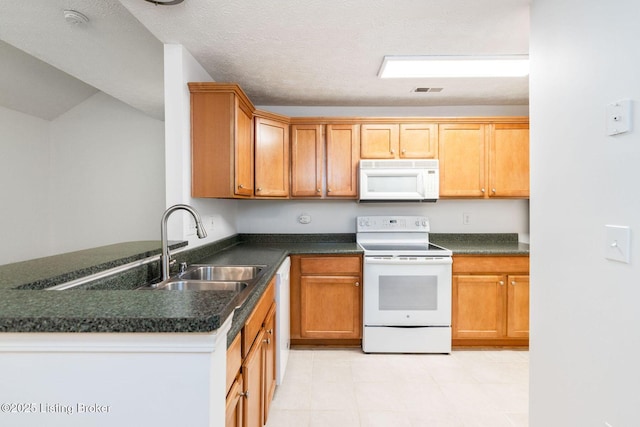 13404 Prospect Glen Way, Prospect, KY 40059 - kitchen with white appliances, dark countertops, and a peninsula