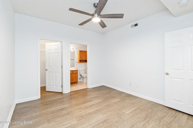13404 Prospect Glen Way, Prospect, KY 40059 - unfurnished bedroom with light wood finished floors, a spacious closet, ensuite bath, and a ceiling fan