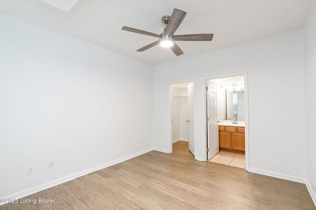 13404 Prospect Glen Way, Prospect, KY 40059 - unfurnished bedroom with a spacious closet, a closet, light wood-style floors, connected bathroom, and a ceiling fan