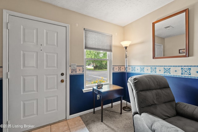 710 Victoria Ct, New Albany, IN 47150 - entryway featuring a textured ceiling and tile patterned flooring