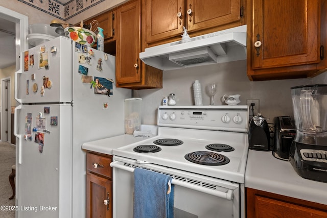 710 Victoria Ct, New Albany, IN 47150 - kitchen featuring white appliances, under cabinet range hood, light countertops, and brown cabinetry