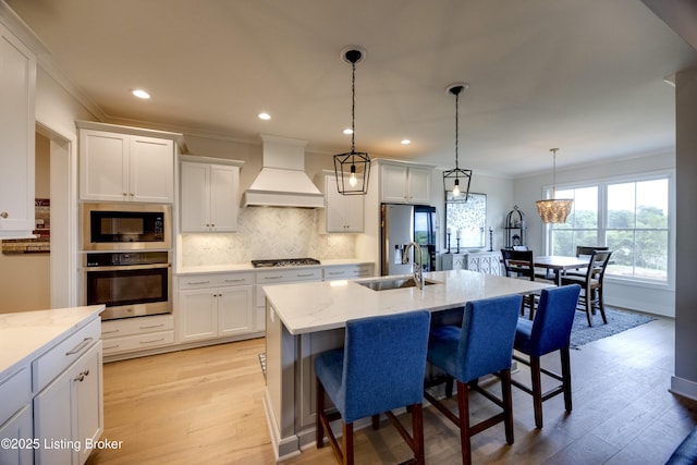 1605 Meremont Ridge Rd, Louisville, KY 40245 - kitchen with appliances with stainless steel finishes, custom range hood, ornamental molding, light wood-type flooring, and backsplash
