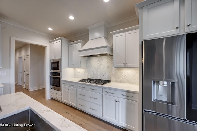 1605 Meremont Ridge Rd, Louisville, KY 40245 - kitchen with appliances with stainless steel finishes, crown molding, premium range hood, tasteful backsplash, and white cabinets