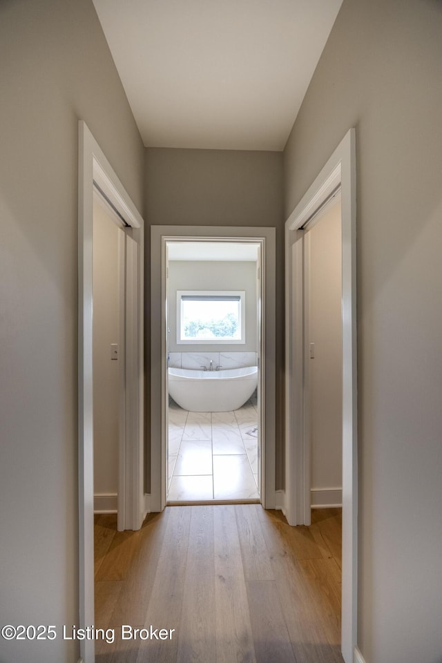 1605 Meremont Ridge Rd, Louisville, KY 40245 - hallway with wood finished floors and baseboards