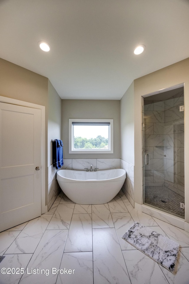 1605 Meremont Ridge Rd, Louisville, KY 40245 - full bath with marble look tiles, a soaking tub, a shower stall, recessed lighting, and a wainscoted wall