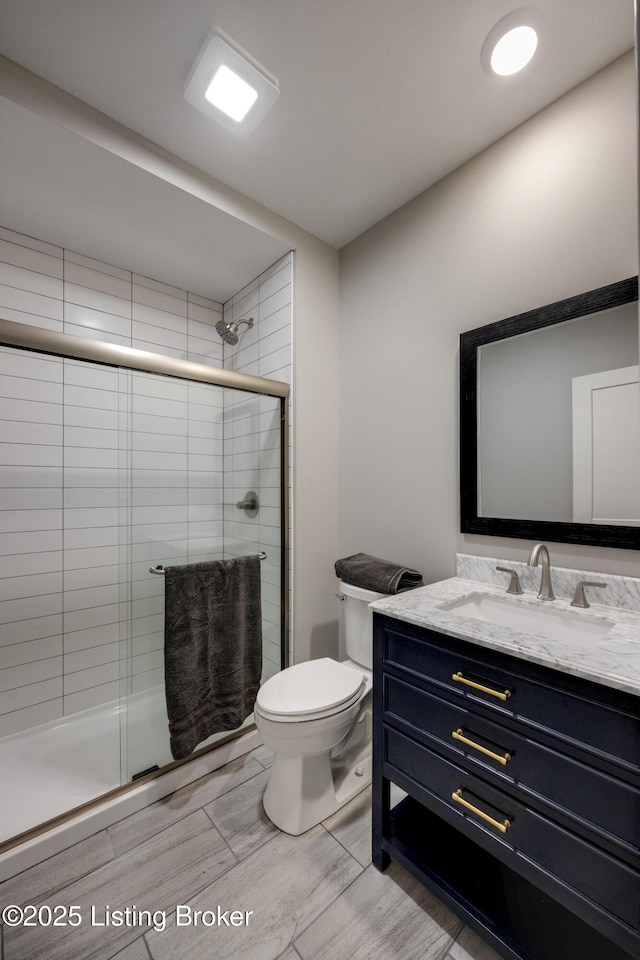 1605 Meremont Ridge Rd, Louisville, KY 40245 - full bathroom with vanity, a shower stall, and wood finished floors