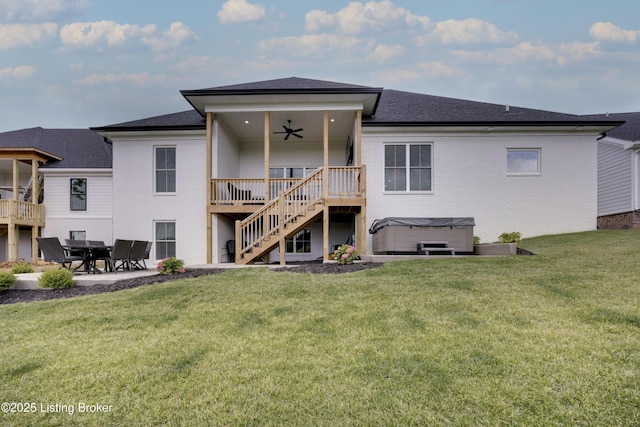 1605 Meremont Ridge Rd, Louisville, KY 40245 - back of property featuring a hot tub, a ceiling fan, brick siding, and stairs