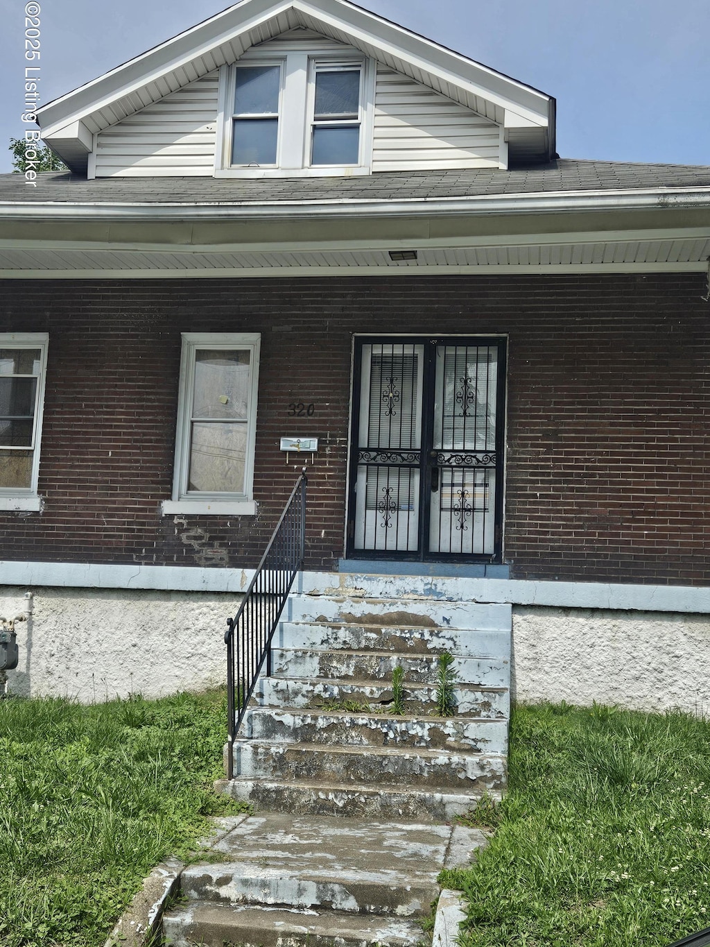 320 N 32nd St, Louisville, KY 40212 - doorway to property with brick siding and covered porch