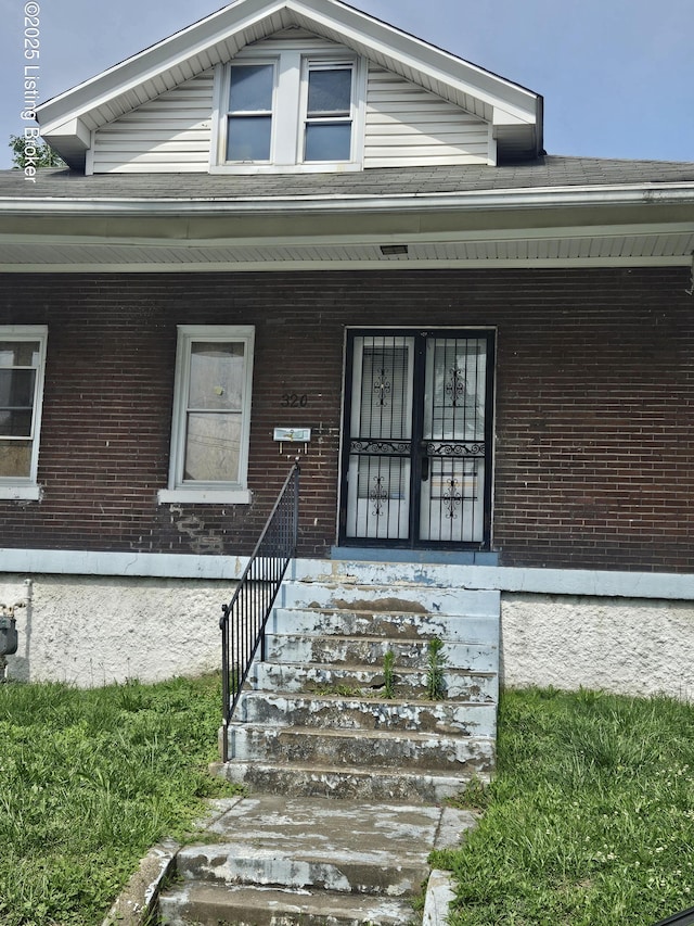 320 N 32nd St, Louisville, KY 40212 - doorway to property with brick siding and covered porch