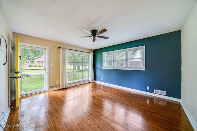 4229 Hillbrook Dr, Louisville, KY 40220 - spare room featuring ceiling fan, a textured ceiling, and wood finished floors