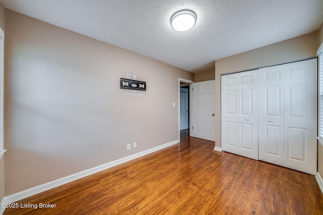 4229 Hillbrook Dr, Louisville, KY 40220 - unfurnished bedroom with light wood finished floors, a closet, and a textured ceiling