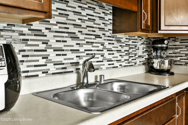 120 Spring Leaf Ct, Shelbyville, KY 40065 - kitchen featuring decorative backsplash, dark brown cabinetry, and light countertops