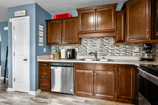 120 Spring Leaf Ct, Shelbyville, KY 40065 - kitchen featuring stainless steel appliances, tasteful backsplash, light wood-style flooring, light countertops, and dark brown cabinetry