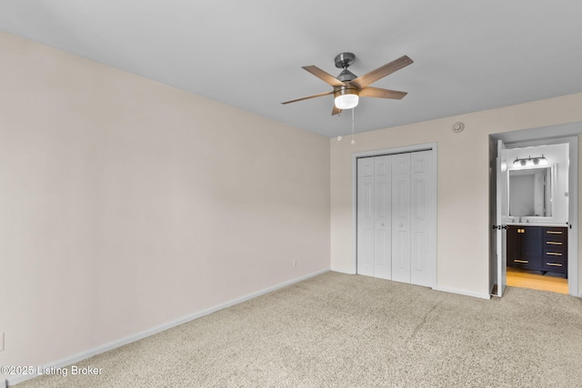 521 Zorn Ave Unit E15, Louisville, KY 40206 - unfurnished bedroom featuring light carpet, a closet, ensuite bathroom, and ceiling fan