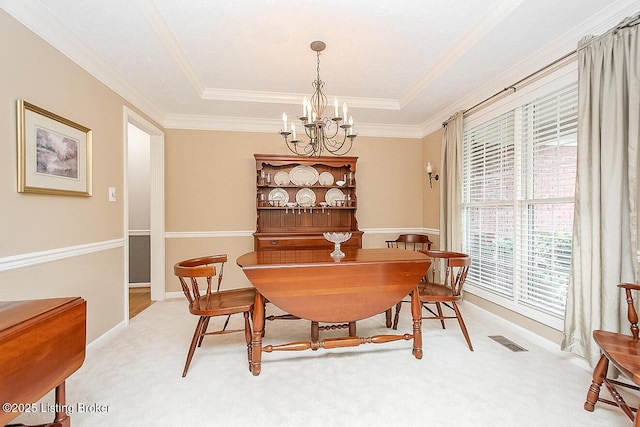 13811 Forest Bend Cir, Louisville, KY 40245 - dining area with a chandelier, a raised ceiling, light carpet, and crown molding