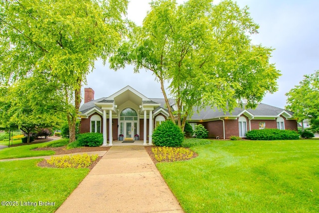 13811 Forest Bend Cir, Louisville, KY 40245 - view of front facade with a chimney and a front yard